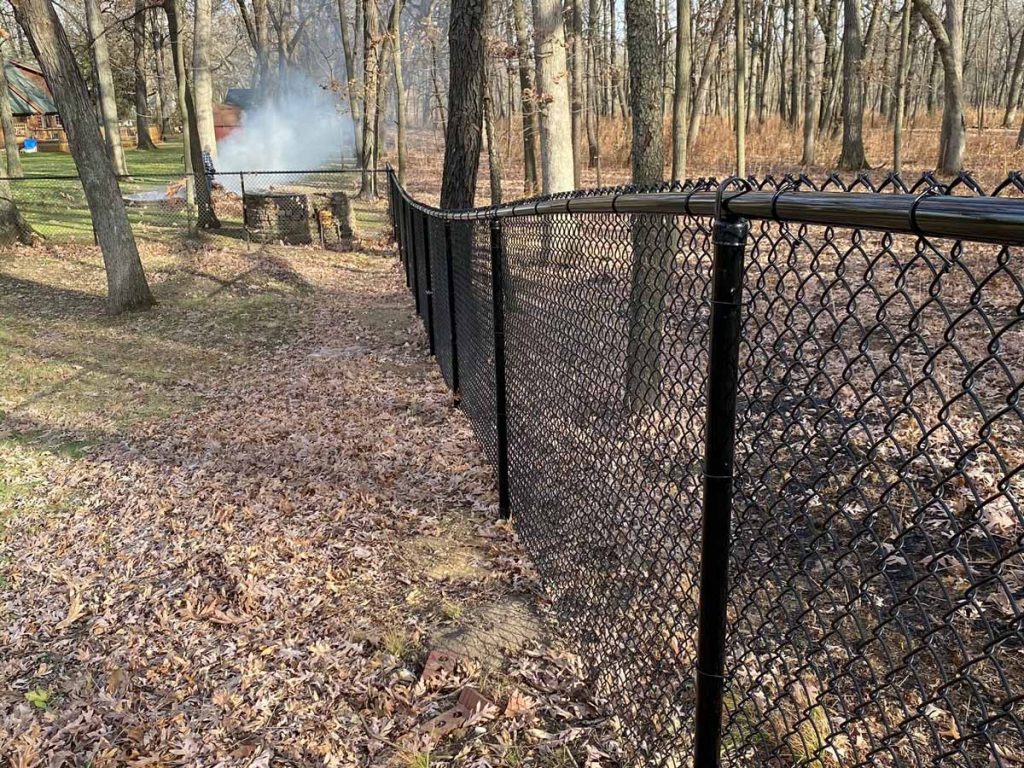 Chain link fence installed in backyard