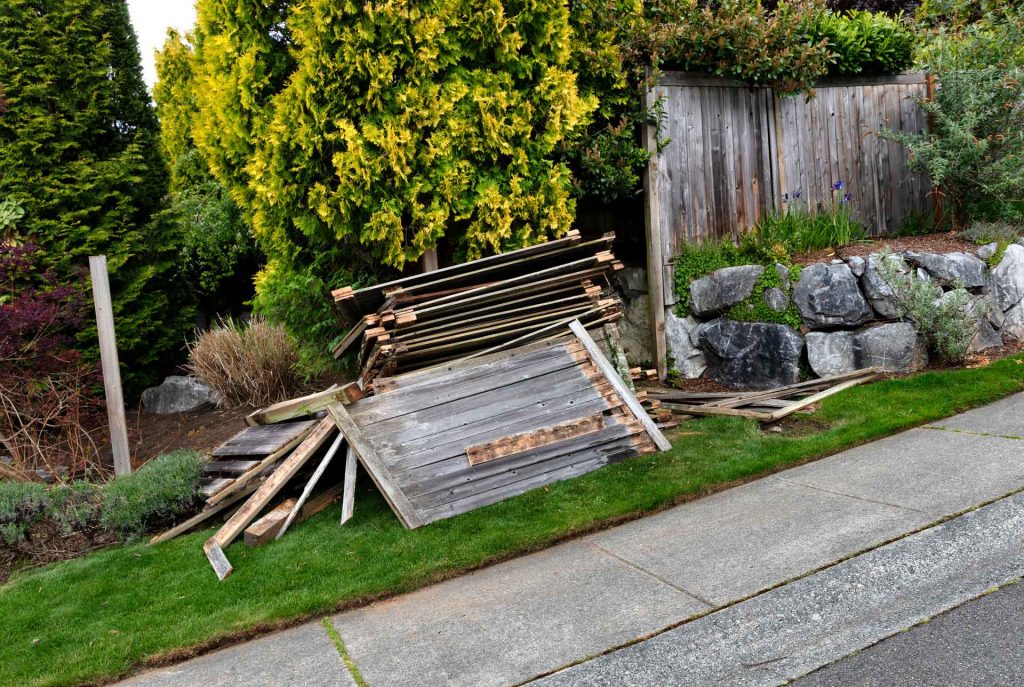 In-progress wooden fence removal